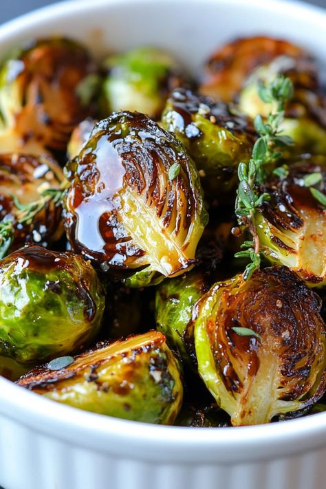 Crispy Brussels sprouts topped with tangy balsamic glaze. A mouthwatering side dish recipe that's healthy and simple to prepare. This pin showcases how to create delicious roasted Brussels sprouts for your dinner table. Air Roasted Brussel Sprouts, Roared Brussel Sprouts, Brussel Sprout Lunch, Thai Peanut Brussel Sprouts, Crispy Brussels Sprouts Recipe, Cranberry Glazed Brussel Sprouts, Glazed Brussels Sprouts Recipe, Roasted Brussel Sprouts Appetizer, Best Balsamic Brussel Sprouts