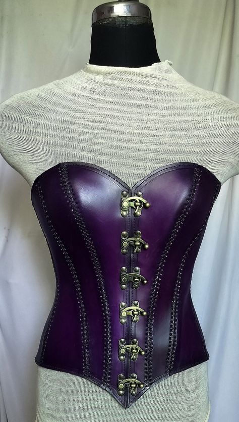 It is handmade leather corset with hand-sewn leather detailing. At front is closed with Lock and back side is adjustable with buckles. We used about 2 to 2.2 mm thick handmade leather. It is hand dyed handmade leather. It is crazy for Gothic, Steampuck costumes and medieval events and Larp.   Corset is hand made from sturdy top-grain leather.  Size is available from 30 to 46 inch, please check our size chart. Bust size in size-chart. DETAILS: ► 100% Handmade ► 100% Genuine leather ► Made on your Armour Corset, Womens Armor, Pirate Corset, Leather Armour, Corset Steampunk, Handmade Leather Work, Dr Wardrobe, Barbie Fashion Sketches, Purple Gothic