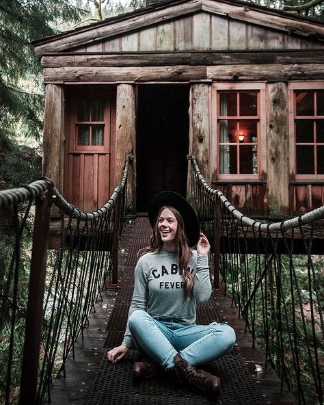 image of a woman in front of a treehouse Treehouse Rentals, Treehouse Point, Treehouse Masters, Treehouse Hotel, Treehouse Cabins, Fall City, Camping Experience, Seattle Washington, Travel And Leisure