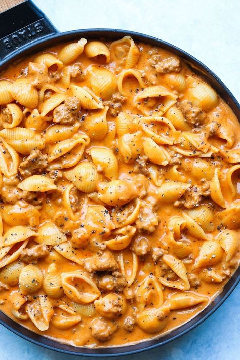 This comfort food recipes is easy and delicious. Creamy beef and shells is about to become a regular in your weeknight dinner line up. The dish features tomatoes, cream, and cheddar cheese, which sounds like it's the perfect meal for anyone who loves cheeseburgers and macaroni and cheese. Goulash Recipes With Shells, Recipes That Use Beef Stock, Skillet Meals Pasta, Creamy Pasta Shells, Yummy Dinner Recipes For Picky Eaters, Creamy Beefy Shells, Beefy Shells Pasta, Hamburger Meat And Shells Recipes, Quick Recipes With Hamburger Meat