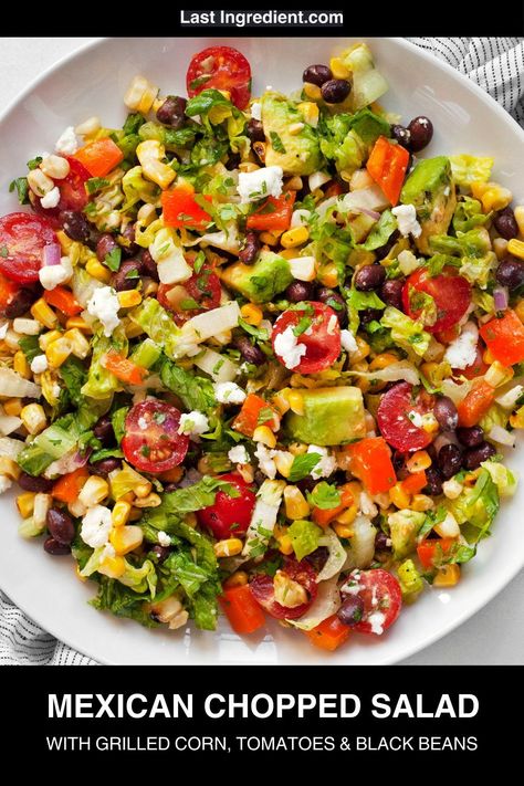 Colorful, crisp and full of flavor, this Mexican chopped salad has grilled corn that brings a little heat and smoke. It starts with chopped romaine as the base and has black beans, tomatoes, bell peppers and avocados. This salad is main dish worthy, and there are lots of ways to customize it with easy additions. Salad With Grilled Corn, Honey Lime Vinaigrette, Mexican Chopped Salad, Mexican Salad, Vegetarian Grilling, Hearty Vegetable Soup, Vegetarian Recipes Lunch, Italian Chopped Salad, Lime Vinaigrette