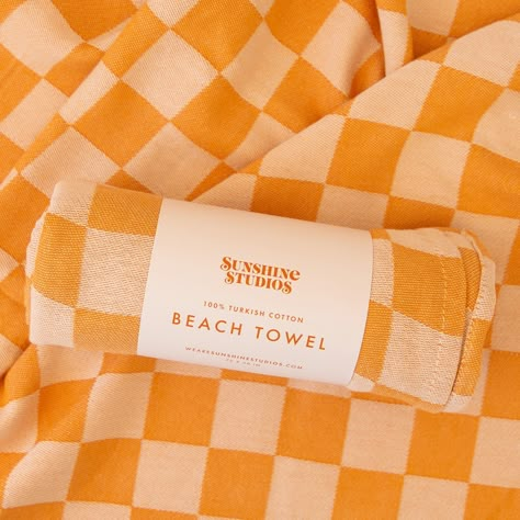 Go ahead and hit the beach in style with our checker-printed towel! With its stay-dry fabric, summertime vibes, and trendy golden checker pattern, you'll be a standout at the shore or by the pool! Dimensions | 72" x 30" Material | 100% Cotton Lightweight + Packable Ultra Absorbent + Quick Drying Checkered Beach Towel, Cute Beach Towels Aesthetic, Beach Towel Design Ideas, Beach Towel Aesthetic, Towel Aesthetic, Cute Beach Towels, Pool Dimensions, Towel Packaging, Trendy Beach Towel