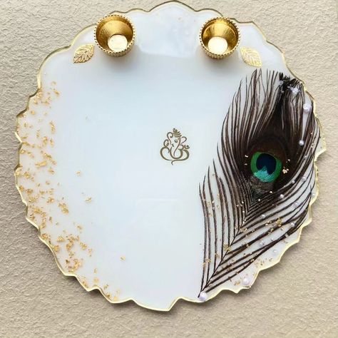 A modern unique resin POOJA PLATE to give grand look your temple area or the special corner of your home.🏚️ It also could be a gteat gift for any occasion.🎁 We can also use this Puja Plate for Rakshabhandhan and other festivals.🧿 This plate is special for this special day of brother & sister and filled with love and joy, with a gift from the heart.💫❣️ Resin Puja Plate is an ideal token of your appreciation and love.💗✨ Resin Art Pooja Thali, Resin Puja Thali, Resin Thali, Resin Pooja Thali, Resin Plates, Heart Resin, Pooja Thali, Resin Work, Handmade Rakhi