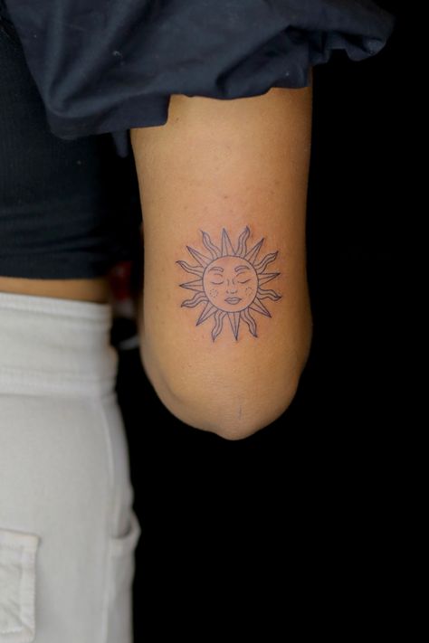 Tattoo ideas for women, sun tattoo, arm tattoo, tattoos for women, minimal tattoo, sun design tattoo, fine line tattoo Sun Back Arm Tattoo, Boho Soul Tattoo, Bold Sun Tattoo, Sun On Back Of Arm Tattoo, Sun Emoji Tattoo, Simple Sun Tattoo With Face, Zodiac Sun Tattoo, Sun Tattoo Elbow Crease, Mother Sun Tattoo