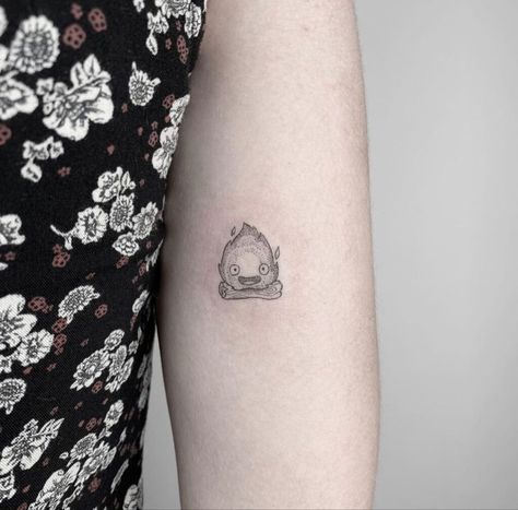 Unique Small Tattoos For Women Simple, Small Calcifer Tattoo, Ghibli Inspired Tattoo, Small Studio Ghibli Tattoo Ideas, Bruh Tattoos, Studio Ghibli Calcifer Tattoo, Tattoo Ideas Studio Ghibli, Studio Gibhili Tatoos, Small Ghibli Tattoo