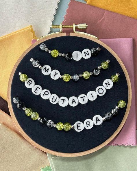 Reputation friendship bracelet photos! This piece was a lot of fun to make, and I’ve got a few more in the works! I had to skip over the bewjeweled one for a while because it was a lot of letter beads. Why did I do that to myself? 😅 But very soon I will have 3 more of these to show you! P.S. I’m already planning ahead with fabric and beads for The Tortured Poets Department! . . . #taylorswift #taylorswiftfanart #friendshipbracelets #swiftie #swiftieart #taylorswiftcrafts #handmadetaylorart ... Letter Bead Ideas, Letter Beads Ideas, Reputation Friendship Bracelet, Loft Fashion, Stitch Stuff, Camp Style, Embroidery Works, Cross Stitches, Jolly Christmas