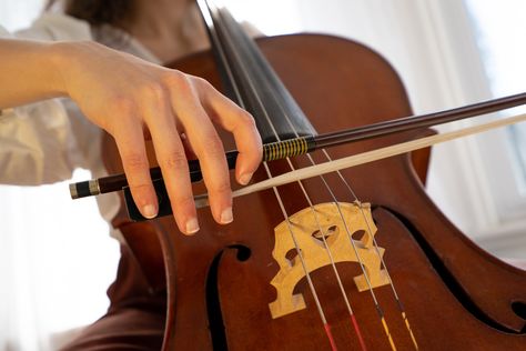 A hand holding a cello bow Cello Photography, Cello Bow, Online Music Lessons, Music Things, Body Poses, Music Lessons, Cubism, Oil Pastel, Pose Reference