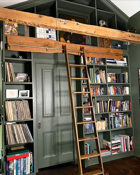 There are stunning brass details on the library ladder we found through an architectural salvage company. The brass roller covers have beautiful curves and the letter P embossed. Each step has a bass rod that runs below it and the hooks on the top of ladder that connect to the brass bar allow the ladder to slide beautifully. We love to find vintage pieces that would have been destroyed or sitting in a cold warehouse if not repurposed. The stories and history that you can dream up behind eac... Antique Library Ladder, Library Shelf With Ladder, Brass Library Ladder, Library Ladder Kitchen, Ladder Art, Library Steps, Sliding Ladder, Cabin Vibes, Antique Library