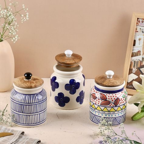 Revamp your storage game with our airtight ceramic jars with wooden lids for a cute yet functional organized look. Use them for masalas, pulses, tea, coffee, sugar and more! Free of any toxins or lead, our ceramics are a healthy and sustainable choice for every home. Available individually and as a set of 3 Airtight jar, ceramic jar, kitchen storage, airtight container, kitchen organization, handpainted ceramics Ceramic Jars Kitchen, Jars With Wooden Lids, Jar Kitchen Storage, Tea Coffee Sugar Jars, Container Kitchen, Jar Ceramic, Jar Kitchen, Coffee Jars, Coffee Storage