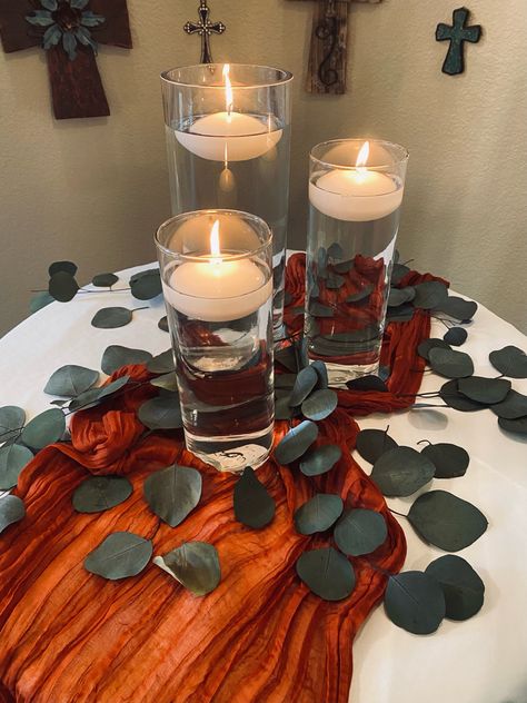 Fall Floating Candle Centerpieces Wedding, Floating Candle Table Runner, Fall Floating Candle Centerpieces, Themed Centerpiece Ideas, Three Candle Centerpiece, Fall Floating Candles, Floating Candles Centerpiece, Terracotta Table Runner, Tea Cup Decorations