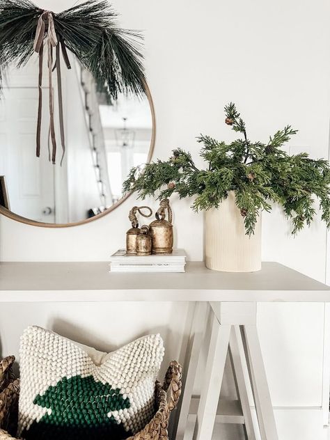 Powder Bath Christmas Decor, Church Pew Christmas Decor, Christmas Console Styling, Foyer Table Christmas Decorating Ideas, Round Mirror Christmas Decor Ideas, Holiday Console Table Decor, Sideboard Christmas Decor Ideas, Christmas Decor Ideas For Foyer, Entry Way Christmas Decor Ideas