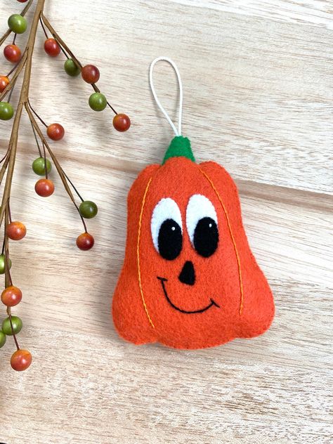 Add a touch of cute to your Halloween decor! This adorable felt pumpkin ornament is sure to add cheer to any room.  **THIS IS A PDF PATTERN DOWNLOAD. ** No finished product will be shipped.  You will receive the PDF pattern for the felt pumpkin Halloween ornament, so that you will be able to sew and create your very own felt ornament.  This pumpkin measures roughly 4.5" tall. This pattern includes a list of all supplies needed and step-by-step instructions with color photos.  All designs and models were created by me and stitched by hand. The ornament in the photo was made from the exact pattern you will receive.  Check out my shop for other fun designs! Pumpkin Sewing Pattern Free, Pumpkin Felt, Pumpkin Ornaments, Felt Ornaments Patterns, Felt Sewing, Pumpkin Ornament, Felt Pumpkins, 2024 Halloween, Felt Ornament