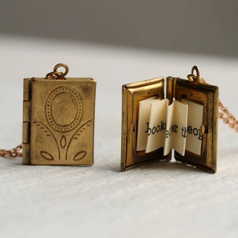 A beautifully detailed miniature book locket, with a personalised message hidden inside! This exquisitely detailed little locket is a miniature book made from solid golden brass. Inside is a secret hidden message, specially folded and fitted inside the locket to look just like the pages of a real book! The locket has a perfectly working hinge and clasp and, if you wish, there is space inside for two tiny photos to be added. The locket is a lovely and delicate size, measuring just 16mm x 10mm (ab Secret Message Locket, Hexagon Tattoo, Teacher Graduation Gifts, Message Necklace, Silk Purse, Book Locket, Miniature Book, Hidden Message, Picture Gifts