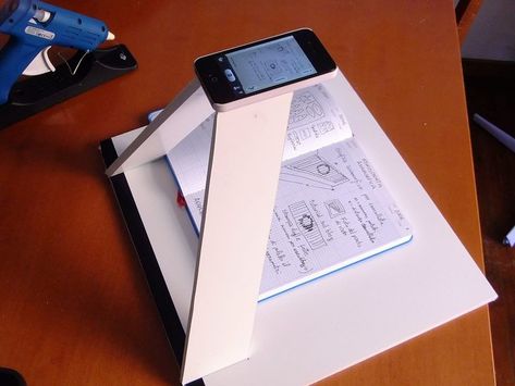 A book "scanner" for your smartphone using foam-core, a craft knife and hot glue. Brilliant. Photo Scanner, Scanning Photos, Iphone Diy, Foto Transfer, Camera Stand, Craft Knife, Iphone 3, Electrical Tape, Diy Photography