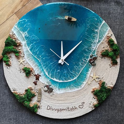 This wall clock is a handcrafted decorative clock that features a breathtaking image of an island, ocean and waves, beach and rocks. The clock is made of epoxy resin and includes a miniature boat, seashells, starfish, and multiple resin turquoise waves. PLEASE NOTE: The clock mechanism is a delicate and complex part of the product. Due to the risk of damage during transportation, the clock mechanism is included in the package but not assembled beforehand. This way, you can ensure that the clock Beach Clock Resin, Resin Ocean Clock, Ocean Art Resin, Resin Clock Diy, Resin Art Clock, Sea Resin, Ocean Clock, Epoxy Wall Clock, Resin Wall Decor