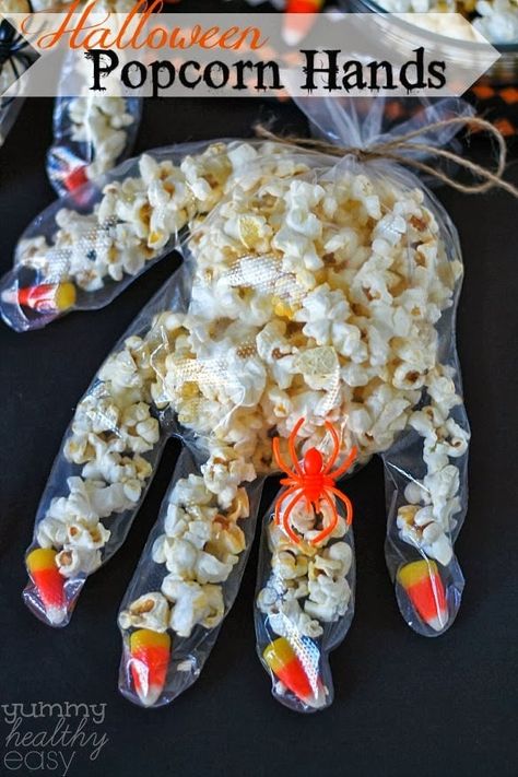 Fun Halloween craft to make with kids! Disposable gloves with candy corn fingernails, filled with popcorn. So cute! Scared Ghost, Fall Bake Sale, Fun Halloween Snacks, Halloween Snacks For Kids, Postres Halloween, Halloween Popcorn, Dulces Halloween, Diy Halloween Costumes For Kids, Halloween Candy Corn