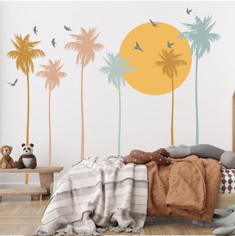 Transport yourself to a tranquil oasis with the vivid imagery of swaying palm trees and a beautiful sunset. Crafted from high-quality, durable vinyl, these wall stickers are designed to stand the test of time. Plus, they're easily removable without leaving any residue, allowing you to update your decor whenever inspiration strikes. Available in 3 size/quantity options: 8 ft. wide x 8 ft. tall - includes 4 palm trees, sun + 5 birds. 12 ft. wide x 8 ft. tall - includes 6 palm trees, sun + 8 birds. Boho Palm Tree, Nursery Aesthetic, Gender Neutral Bedrooms, Beach Wall Murals, Tree Wall Decals, Mural Tropical, Bedroom Mural, Palm Tree Wall, Trees Wall Art