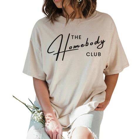 The Homebody Club Graphic Tee is the perfect shirt for lazy days at home or casual outings. Crafted from high-quality, sustainable materials, this ultra-soft, relaxed-fit tee embodies our commitment to inclusive fashion. The Homebody Club Graphic Tee is a celebration of tranquility and style, a tee that speaks to your inner homebody. Embrace the warmth and unity at the heart of Brandy with The Homebody Club Graphic Tee. Homebody Club, Homebody Shirt, Inclusive Fashion, Club T Shirt, Diy Cricut, Lazy Days, Sustainable Materials, Perfect Shirt, Oversized Tshirt