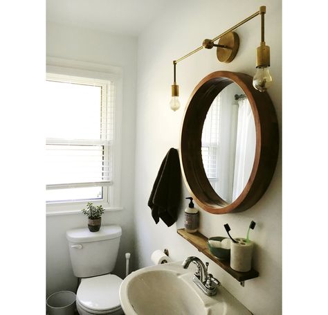 Sconces in mirror bathroom