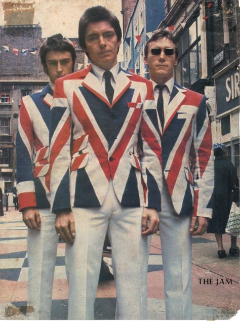 The Jam pose in Carnaby Street in the 70s wearing their Union Jack Jackets inspired by The Who in the 60s. The Style Council, Swinging London, Paul Weller, The Jam Band, Rock Festival, British Music, Carnaby Street, The Jam, British Invasion