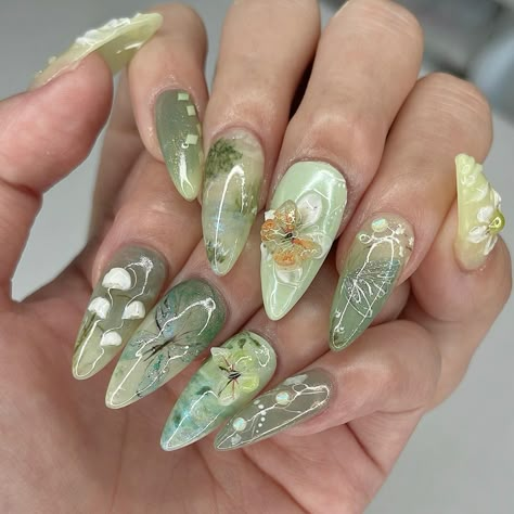 🧚🏻‍♂️ green fairy meadow 🍃 I can’t help but say I slayed this set 💯💚 my top 3 fairycores for sure 🤭 My custom design on a Medium Stiletto @apresnailofficial Gel-X, client asked for fairycore and left everything up to me ✨ #nailinspo #naildesign #vancouvernails #fairycorenails #gardennails #naturenails #nails2inspire #trendynails #gelxinspo #pinterestnails #summernails #springnails #3dflowernails #3dnailart Princess Tiana Inspired Nails, Green Stilletto Nails, Aug Nails, Tiana Nails, Fairy Nails Designs, Green Aesthetic Nails, Green Fairy Nails, Enchanted Forest Nails, Enchanted Nails