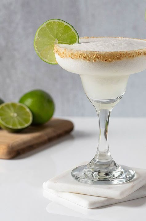 This frozen margarita was inspired by the flavors of a cool and creamy Key lime pie. Whip up a batch of these easy frozen margaritas for Cinco de Mayo or anytime you want a sweet and refreshingly tart treat! #healthydrinks #lowsugardrinks #drinkrecipes #drinkideas #healthyrecipes Margarita Recipes Sweet, Key Lime Pie Margarita, Key Lime Pie Margarita Recipe, Key Lime Margarita Recipe, Texas Roadhouse Key Lime Margarita Recipe, Margaritas With Frozen Limeade, Key Lime Margarita Recipe Texas Roadhouse, Key Lime Pie Drink Alcohol, Key Lime Daiquiri