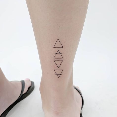 8 Small Tattoos That Mean Big Things | Tattoodo Tattoos Elements, 4 Elements Tattoo, Ampersand Tattoo, Element Tattoo, Alchemy Tattoo, Unalome Tattoo, Circle Tattoo, Om Tattoo, Dot Tattoos