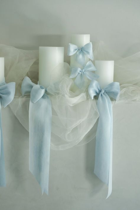 Sky Blue Silk Ribbon Introducing our NEW Sky Blue Silk Ribbon, a luxurious addition to your flower bouquet or decor styling. This light blue ribbon features a unique "crushed" marbling effect with various shades of pale blue that beautifully mimic the serene sky lined with wispy clouds. Premium Silk: Crafted from the finest silk, this ribbon provides a soft and smooth texture that exudes elegance. Unique Marbling: The crushed marbling effect adds depth and visual interest, creating a stunning vi February Wedding Ideas, Steel Blue Wedding, Blue Bridal Shower Decorations, Steel Blue Weddings, Diamonds And Denim Party, Light Blue Nursery, Blue Silk Ribbon, Light Blue Decor, Wispy Clouds