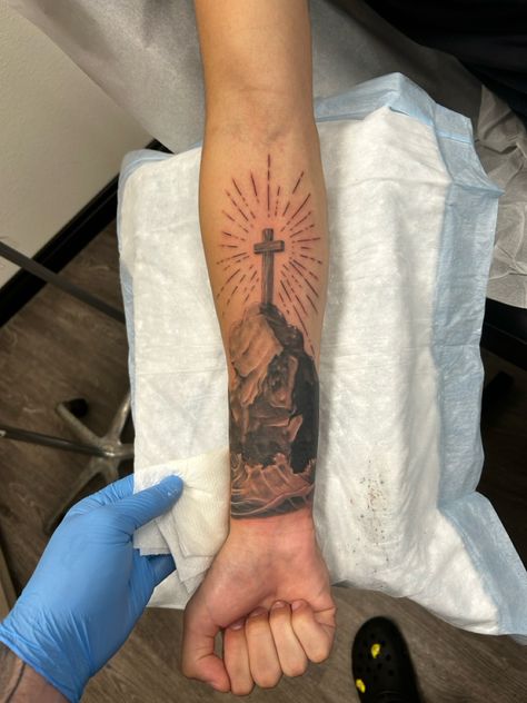 Jesus forearm tattoo cross tattoo Back Forearm Tattoo Men Ideas, Religious Forearm Tattoo, Biblical Sleeve Tattoos, Christian Tattoos For Men Sleeve, Cross Forearm Tattoo Men, Forearm Cross Tattoo Men, 3 Crosses Tattoo Men, Cross Forearm Tattoo, Outside Forearm Tattoo Men Sleeve