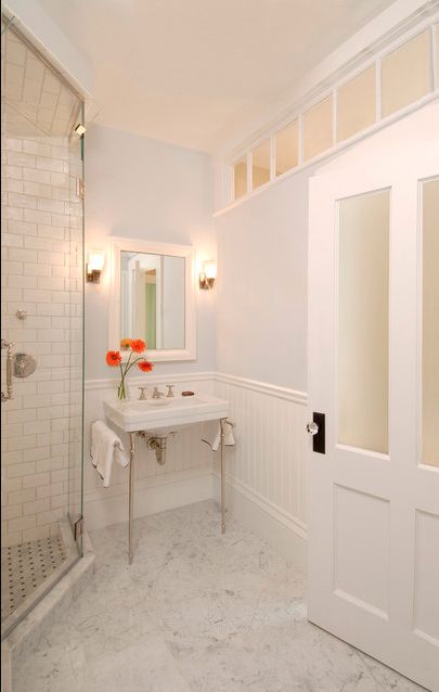 Add windows to a windowless bathroom, even if they’re not to the outside world. | 27 Clever And Unconventional Bathroom Decorating Ideas Windowless Bathroom, Beadboard Wainscoting, Casa Vintage, Transom Windows, Decor Baie, Bathroom Windows, Basement Bathroom, Blue Bathroom, Bathroom Doors