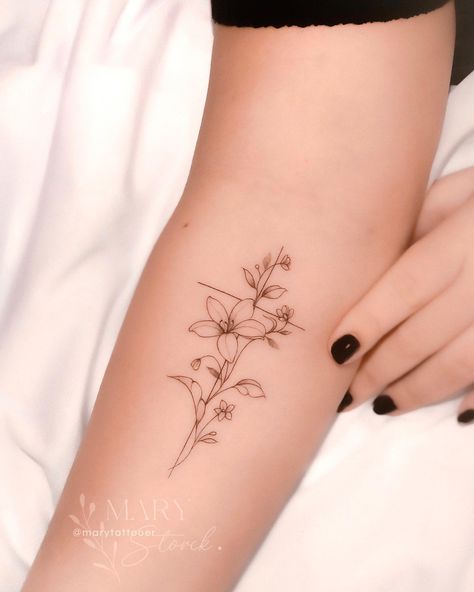 38 Beautiful Lily Tattoo Ideas to Inspire You in 2024 Small Tiger Lilly Flower Tattoo, Lilys Aesthetic Flower Tattoo, Cute Lily Tattoos, Lily Small Tattoo, Lily And Bird Tattoo, Lily Line Tattoo, Lilly Tattoo Ideas, Delicate Lily Tattoo, Lily Vine Tattoo