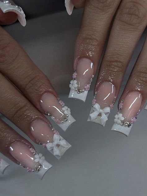 #whitenail #nails #whitenails #nailart #inspire #blingnails #fallnails #almondnails #explorepage #ombrenails #summernail #nudenail #getnailed #dmv #ombr #dmvnailtech #glowup #glownails #springnails #stilletoes #mylarnails #dopenailtechs #fallcolors #qualitynails #nailsofinstagram #nail #naildesigns #fredericksburgnailtech #nailsnailsnails #nailsaddict Wedding Nails With Rhinestones And Pearls, Elegant Bling Nails, Nail Ideas Acrylic Charms, Bow And Flower Nails, Nail Charm Placement, Birthday Nails Glam, Medium Acrylic Nails With Charms, Gel Nails Ideas White, 3d Flower French Tip Nails