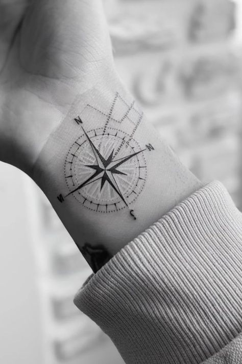 Wrist tattoo of a detailed compass rose with directional markings. Star Wrist Tattoos For Women, Fine Line Compass Tattoo, Compass Tattoo Ideas For Women, First Time Tattoo Ideas Woman, Compass Tattoo Feminine, Tattoo Idea For Women, North Star Tattoo, North Star Design, Inside Finger Tattoos