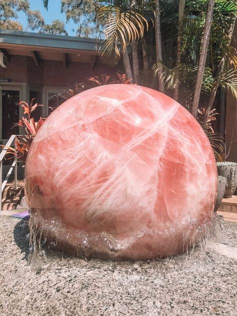 This Giant sphere has stole My heart! 🔮🔮🔮  This rose quartz sphere spins each and every day, and sits in the centre of the courtyard at the heart of the Crystal Castle in Australia! 💎 💎 💎   Photo:Crystal Castle Gemstones Decor, Huge Crystal, Meditation Room Decor, Crystal Castle, Crystal Aesthetic, Museum Displays, Raw Crystals, The Courtyard, Crystals In The Home