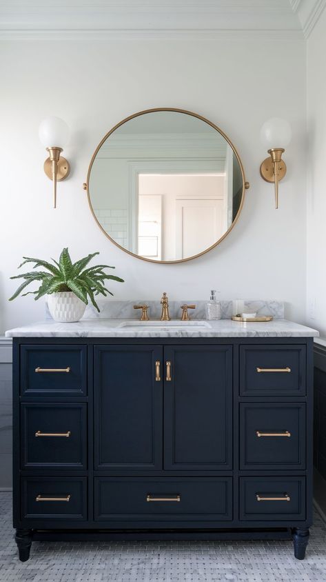 Explore elegant blue bathroom designs with bold tiles, beautiful vanities, and modern fixtures. Perfect for creating a calming, stylish, and functional space. Bathroom Color Vanity, Half Bathroom Blue Vanity, Coastal Cottage Bathroom Ideas, Bathroom Navy Blue Vanity, Dark Blue Bathroom Cabinets, Gold And Navy Bathroom, Bathroom With Navy Vanity, Guest Bathroom Wallpaper Ideas, Small Navy Bathroom