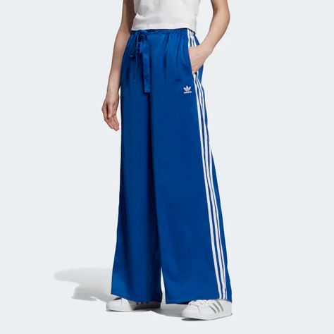 These track pants refashion an athletic style with a feminine touch. They're made of soft satin and come with a high ruched waist and wide pleated cuffs. 3-Stripes down the legs complete the standout look. Adidas Hose, Track Pants Women, Adidas Tracksuit, Womens Wide Leg Pants, Casual Bottoms, Stylish Pants, Adidas Fashion, Sporty Outfits, Tracksuit Bottoms