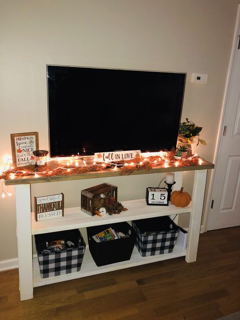 Sectional Fall Decor, Decorate Apartment For Fall, Fall Studio Apartment Decor, Simple Fall Apartment Decor, Fall Living Room Tv Stand Decor, Small Apartment Halloween Decor Ideas, Halloween Decor For Tv Stand, Small Apartment Fall Decor Cozy, Fall Decor For Apartment Small Spaces