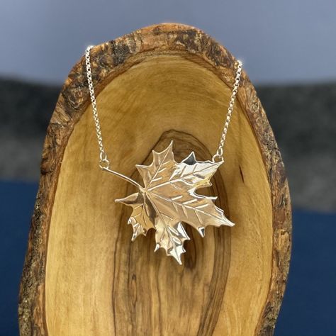 A perfectly shiny maple leaf centered on a rolo chain. Material: sterling silver Dimensions: 47mm x 44mm Chain Type: rolo Chain Width: 1.5mm Chain Length: 17.5" Finish: high polish Weight: 9.84g This handmade piece is a one of a kind! Even if I make something with a similar shape or layout, no two pieces will ever be exactly alike! Leaf Necklace Silver, Maple Leaf Necklace, Silver Maple Leaf, Steampunk Accessories, Beaded Jewels, Leaf Bracelet, Hand Craft, Leaf Jewelry, Jewelry Lookbook