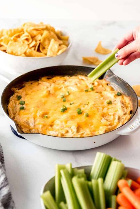 Buffalo Chicken Dip is a creamy, cheesy, hot dip that is perfect for parties, and fantastic with tortilla chips or crunchy veggies. It's protein-packed and loaded with big flavors that are just as good reheated the next day if you happen to have leftovers. #buffalo #chicken #dip #easy #party #gameday #appetizers #cheese Buffalo Chicken Dip Ranch Dressing, Buffalo Chicken Dip Easy Recipes, Buffalo Chicken Dip Oven, Cheesesteak Dip, Gameday Appetizers, Refried Bean Dip, Appetizers Cheese, Buffalo Dip, Crunchy Veggies