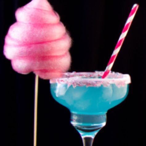 Discover the 'Blue Cotton Candy Cocktail Recipe,' a whimsical mix of vodka, blue curacao, and cotton candy for a fun, festive drink. Candyland Cocktails, Cocktail Recipes Cotton Candy, Cotton Candy Alcoholic Drink, Alcohol Drinks With Cotton Candy, Blue Cotton Candy Cocktail, Vodka Blue Curacao Drinks, Cotton Candy Martini, Cotton Candy Drinks, Cotton Candy Cocktail