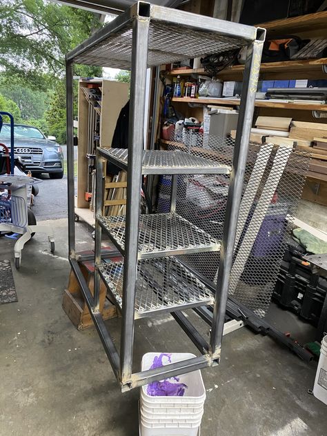 Built and installed 3 shelves and added expanded to the bottom. Welding out the bottom side of all the shelves in this pic. Cart is upside down in this pic. Shelves and uprights for the shelves are made with 1x1x1/8” square tubing with #9 expanded metal  sheet. Square Tubing Projects Ideas, Square Tube Welding Projects, Metal Square Tube Projects, Squarebody Welding Rig, Tub Welding Rig, Table Build, Welding Cart, Expanded Metal, Collection Display