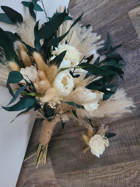 This gorgeous bouquet features ivory/cream shades of sola wood flowers with dark emerald green colored preserved greenery, pampas grass, and other dried filler. This is the perfect boho look for your big day! Message me for cusotmiation - my color chart is in the images and 1-2 colors can be included upon request. Greenery And Pampas Grass Bouquet, Green And Pampas Wedding, Emerald Green Bridesmaid Bouquet, Boho Emerald Green Wedding, Black And Green Wedding Bouquet, Dark Green Boutonniere, Emerald Color Palette Wedding, Emerald Green Flower Bouquet, Black And Dark Green Wedding