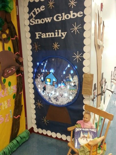 The Snow Globe Family- door decorating competition. We projected a GIF image of snowflakes falling! Too cute! Door Decorating Contest Christmas School, Winter Wonderland Door Decorations For School, Holiday Door Contest, Snowglobe Door Decorations For School, Christmas Door Competition, Snow Globe Door Decorating Contest, Winter Door Classroom, Snow Globe Office Cubicle, Snowflake Door Decorations Classroom