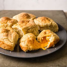 North Carolina Cheese Biscuits by Cook's Country -- The cheesiest, fluffiest biscuits you've ever tasted. North Carolina Cheese Biscuits, Cooks Country Recipes, Donut Toppings, Fluffy Biscuits, Cookie Toppings, Caramel Tart, Tar Heel, Chicken And Biscuits, America's Test Kitchen Recipes