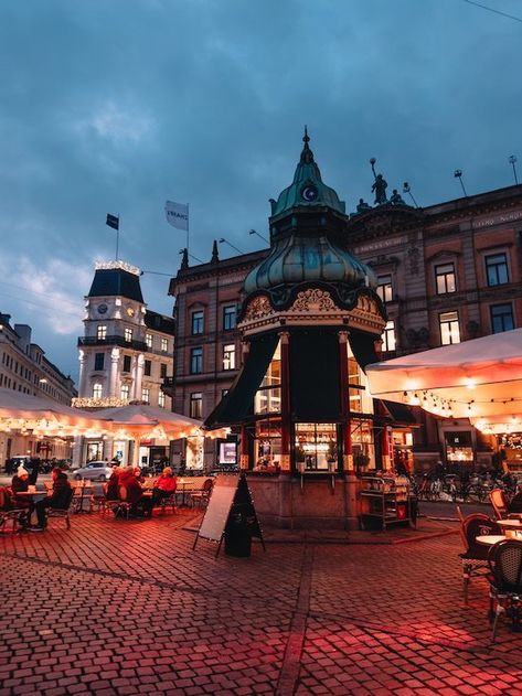 Blue skies and warm hygge lightbulbs creating an inviting glow at a street cafe in Copenhagen Danish Pancake Balls, Copenhagen Tivoli, Danish Pancakes, Danish Cuisine, Christmas Hygge, Cardamom Buns, Danish Pastry, Round Tower, Things To Eat