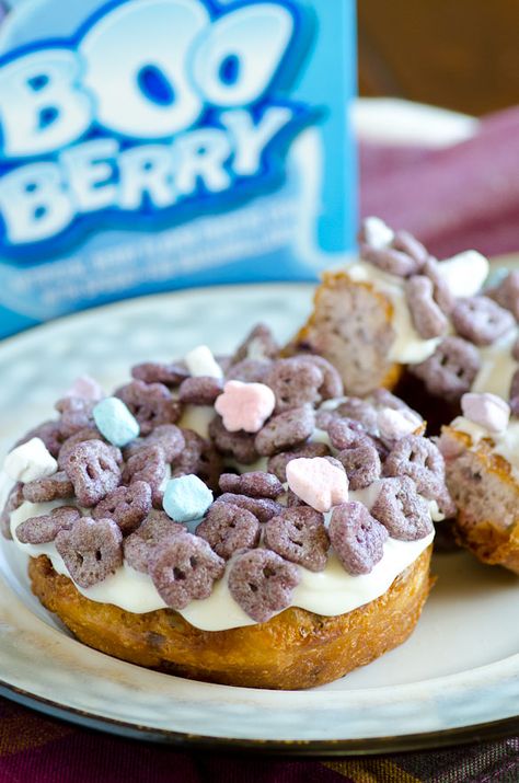 Boo Berry Donuts - using General Mills Monster Cereal collection and Pillsbury Grands! Blueberry Biscuits! Baby Cake Donut Maker Recipes, Boo Berry Cereal, Cereal Popsicles, Cereal Donuts, Donut Maker Recipes, Donuts Fried, Monster Cereal, Fun Breakfast Ideas, Boo Berry