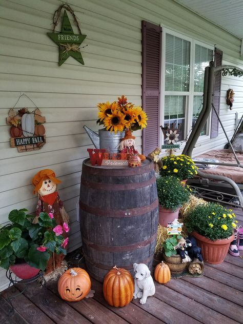 Whiskey barrel, Scarecrow, pumpkins and mums decorating our porch 2016 Whiskey Barrel Decor, Primitive Fall Decorating, Barrel Flowers, Wine Barrel Decor, Autumn Porch, Fall Yard Decor, Fall Crafts For Adults, Fall Porch Decor, Barrel Decor