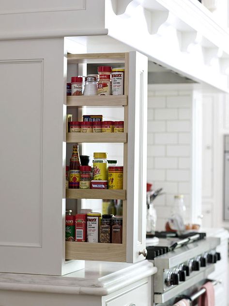 Pullouts to the side of the cooktop provide storage for spices and cooking oils. Kitchen Storage Ideas, Driven By Decor, Kabinet Dapur, Small Kitchen Storage, Kitchen Hacks Organization, Spice Storage, Kitchen Cabinet Storage, Storage Design, Favorite Kitchen