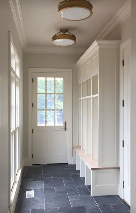 Mudroom With Vaulted Ceiling, Mudroom Ceiling Lights, Mudroom Laundry Room Lighting, Bluestone Mudroom, Mudroom Entry Door, Mud Room Door Exterior, Mudroom With Bathroom Layout, Laundry Room At Front Of House, Mud Room Exterior Door