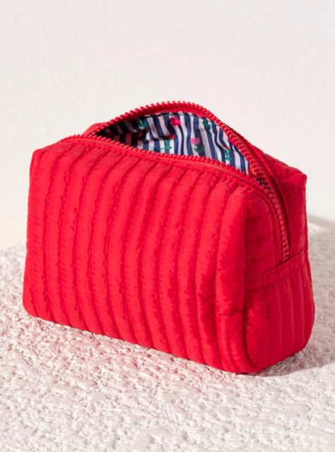 Perfect your on-the-go lifestyle with Shiraleah's Ezra Small Boxy Cosmetic Pouch. This pouch features a quilted nylon body and a boxy silhouette, perfectly matching the material throughout Shiraleah's Ezra collection. This handy pouch is perfect for storing your makeup, toiletries or any odds and ends that you may need during travel or on a daily basis! General Info: Features a top zip closure, 1 inner zip pocket, and 1 inner slip pocket Shiraleah is a trend-driven lifestyle brand focused on the little gifts that make life special! Made from nylon Measures L 7" x w 3" x h 4" Made in China Fancy Shop, Large Cosmetic Bag, Odds And Ends, Small Pouch, Free People Shoes, Ankle Boots Flat, Small Pouches, Fashion Jewelry Earrings, Cosmetic Pouch